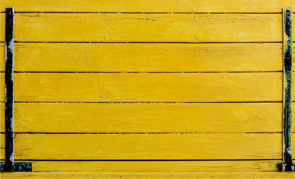 Yellow wood wall with horizontal planks
