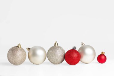  Christmas balls in a row on white background. Christmas wide pa clipart