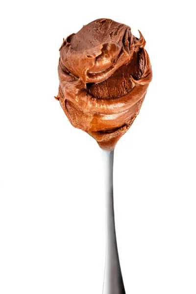 Caramel swirl in a spoon isolated on white background, top view. — Stock Photo, Image