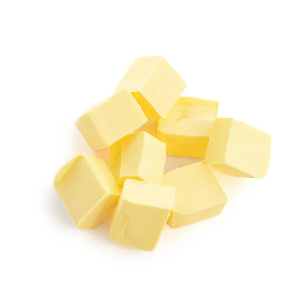 在白色背景上隔离的黄油碎片 顶部视图 鲜奶油块关上了 — 图库照片