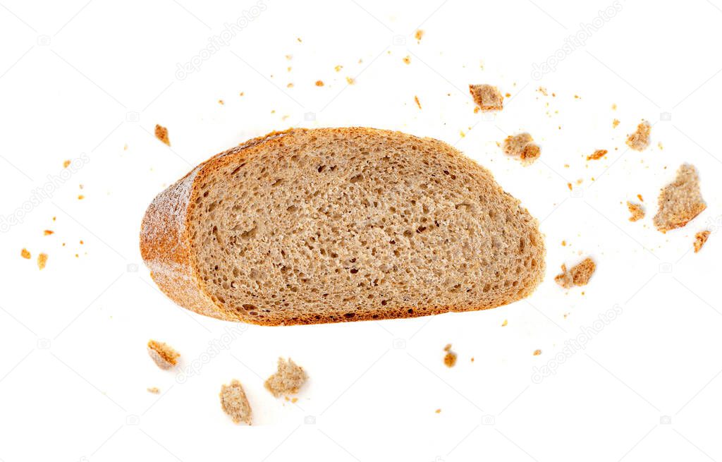Bread slice and crumbs isolated on white background. Top vie