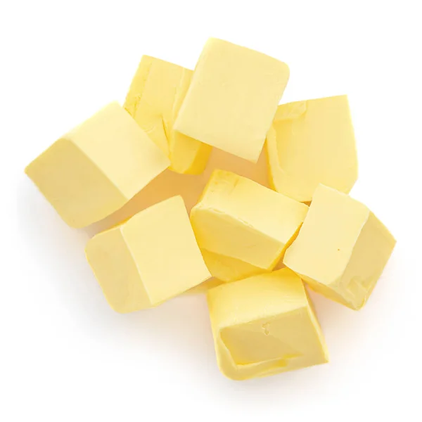 白色背景上孤立的奶油碎片 新鲜黄油立方体顶部视图 — 图库照片