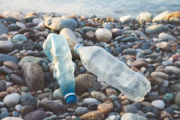 land and sea pollution pollution, ecological problem, used plastic bottles on sea shore