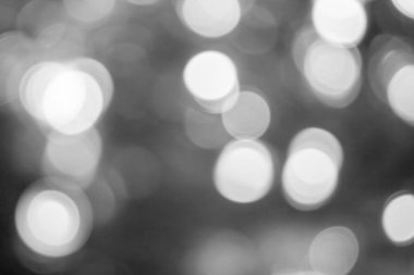 Bulanık ışıklar koyu gri arka plan. Yumuşak ışık ile soyut bokeh. Parlak Noel dokusu