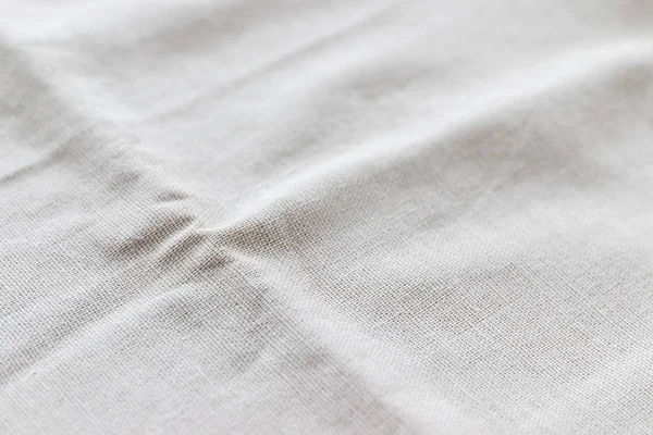 Soft natural linen texture. Crumpled fabric background. Selective focus. Closeup view — Stok fotoğraf