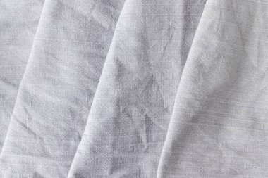 Doğal keten kumaşın çapraz dokusu. Buruşuk buruşuk çuval bezi dokusu. Seçici odaklanma. Yakın görünüm