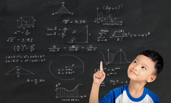 Asian boy holding finger at math geometry formulas on black background.