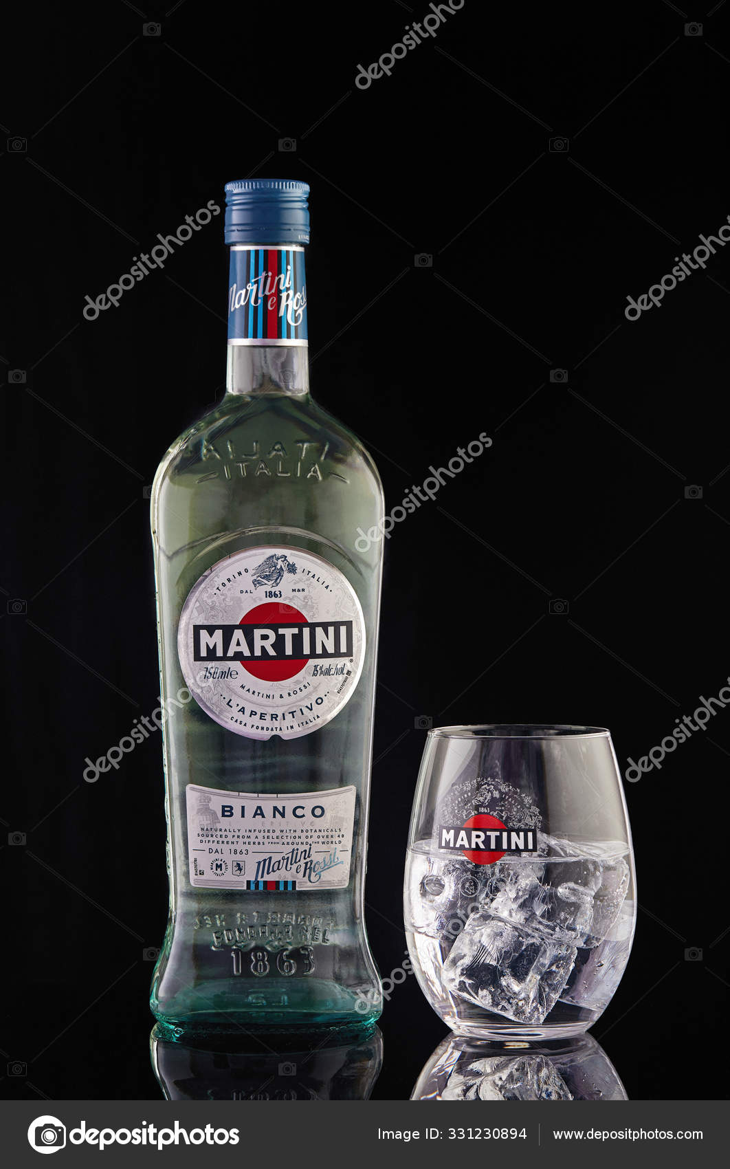 Martini bottle and martini glass with ice isolated on a reflection. – Stock Editorial Photo AlexDon24 #331230894