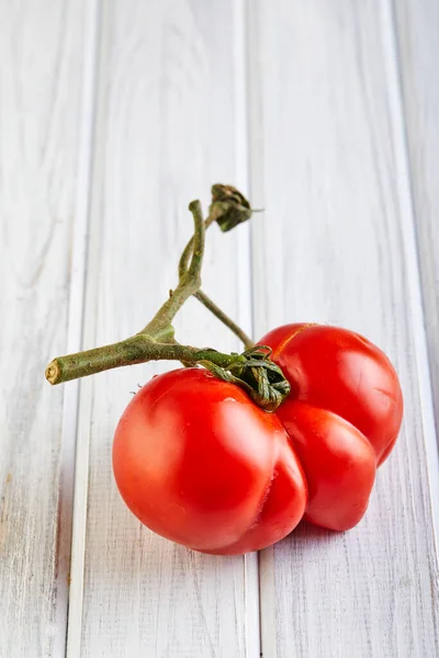 Severely malformed mutant tomato. Ugly fruit. Food shops mostly prefer the best quality fruit and vegetables, or slightly lower-quality goods sold for a bit less. Ugly fruit is not in high demand.