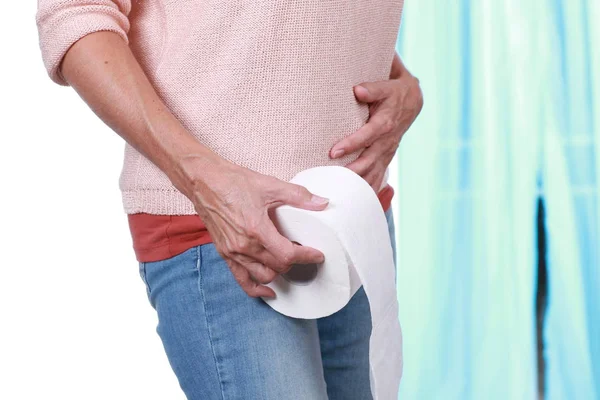 Mature woman with diarrhea and toiletroll — Stock Photo, Image