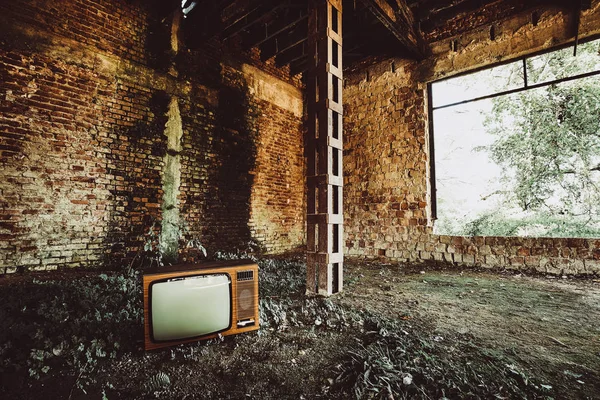 Old television in abandoned building
