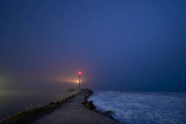 Small lighthouse in the lake at night — Stock Photo, Image