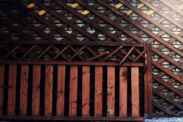 Wooden diagonal trellis and fence with sunlight — ストック写真