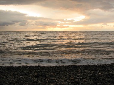 Günbatımı plaj sandalyesi ile denize