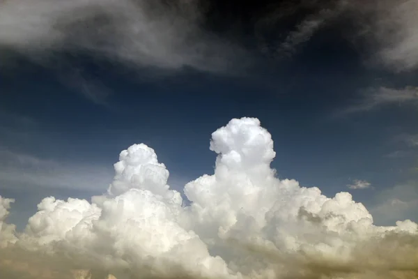 Saturated storm clouds against the dark sky, dark blue tint — Stock Photo, Image