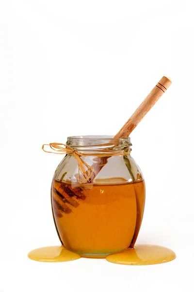 Delicious manis madu dengan dipper dalam botol kaca . — Stok Foto