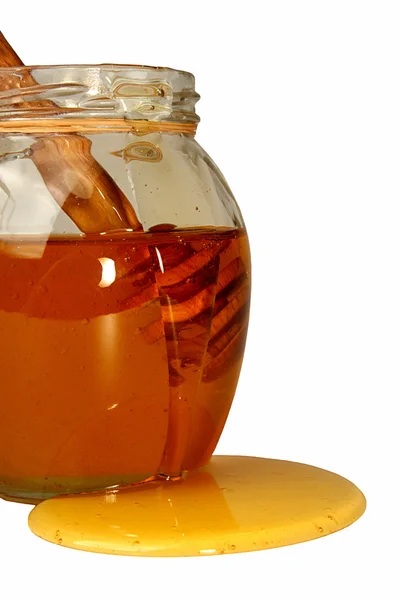 Lahodný sladký med s naběračka do sklenic. — Stock fotografie