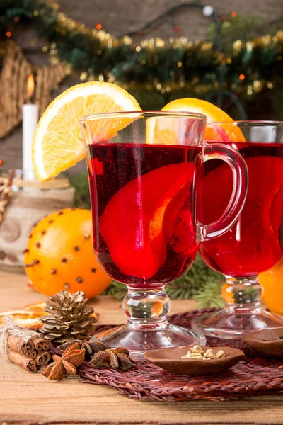 Two glasses of mulled wine over on wooden table. — Stock Photo, Image