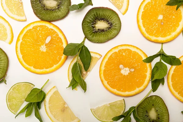 Orange fruit, lemon, lime, mint, kiwi top view. — Stock Photo, Image