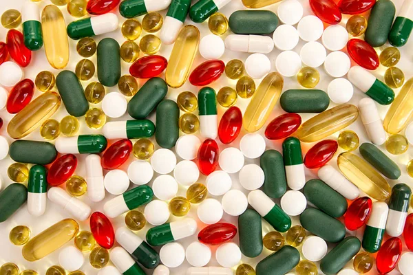 Pills background. Heap of medicine tablets and pills different c