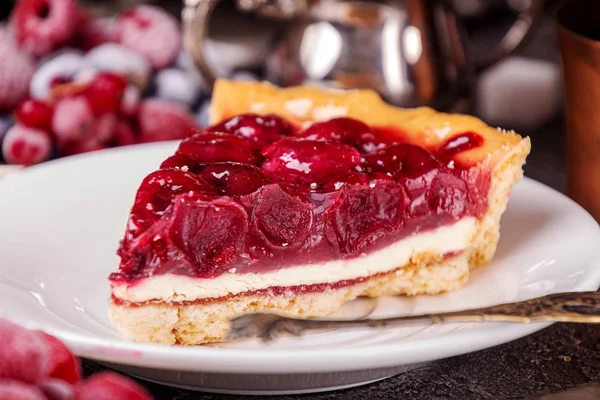 Cheesecake with cherry. Piece of cake on white plate. — Stock Photo, Image