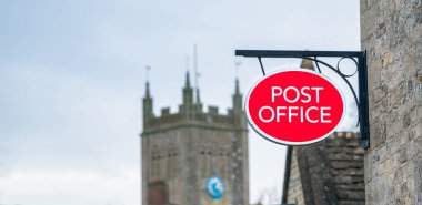 Post Office sign in rural location, England, United kingdom clipart