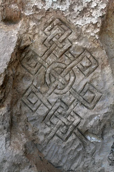 Ornament on the wall of an ancient temple — 스톡 사진