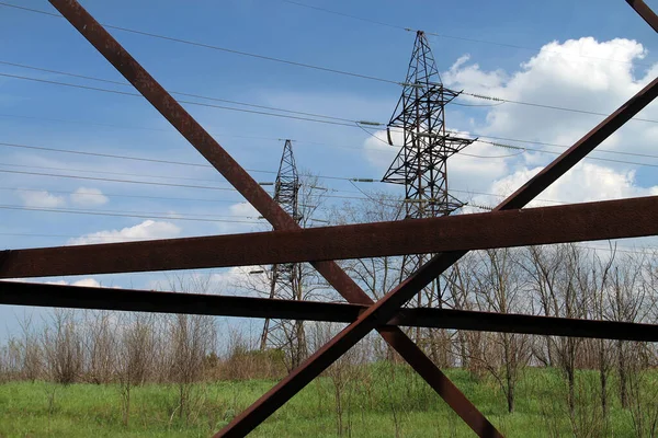 Power transmission towers against the blue sky