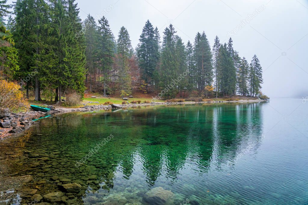 Idyllic autumnal view in Lake Tovel, Val di Non, Province of Trento, Trentino Alto Adige, Italy.