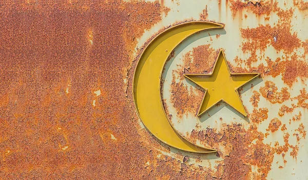 old islam symbol on rusty metal