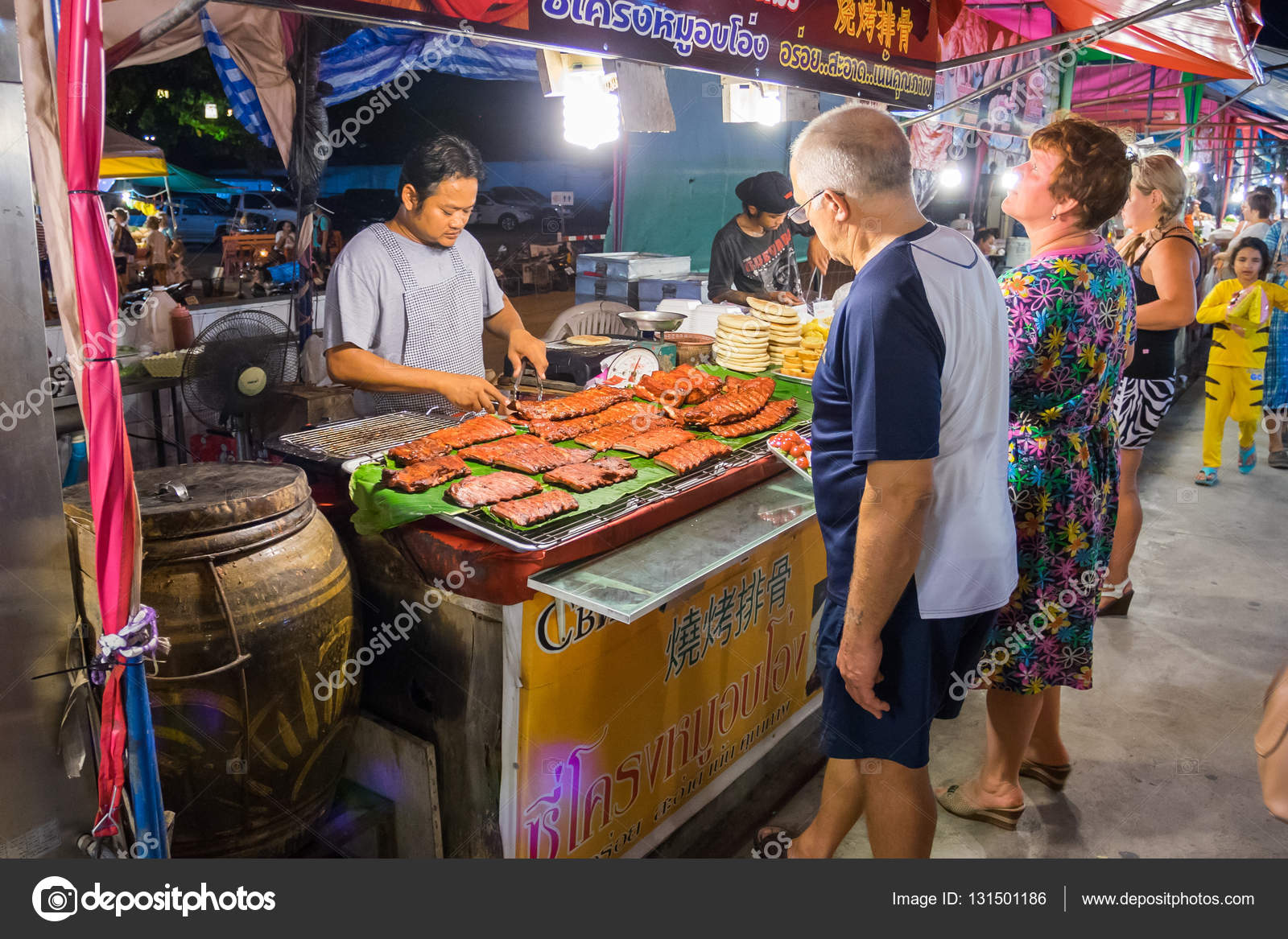 Street food seller selling seafood in the night market in Pattaya