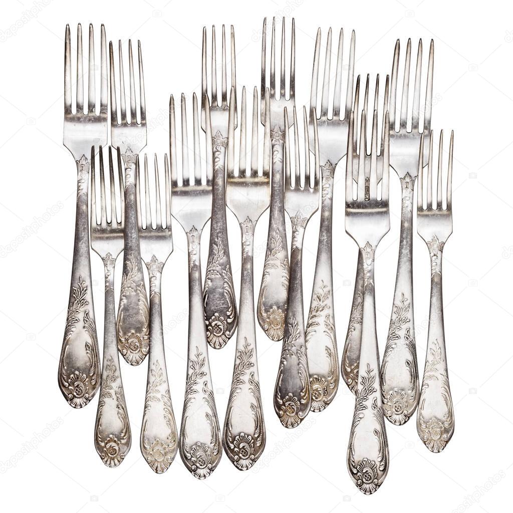 Aged vintage silver forks isolated on white