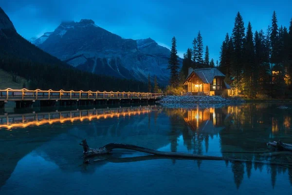 Cabins in Emerald Lake during a vibrant sunny summer day. Located in Yoho National Park, British Columbia, Canada. Summer season is coming. Bear country. Beautiful landscape background concept