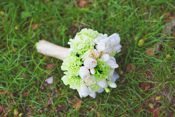 Beautiful wedding bouquet of flowers and greenery and blur background, selective focus. Amazing happy sunny day