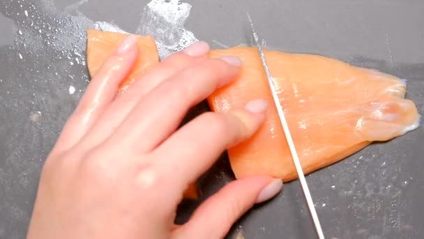 Female Hand Cuts Red Salmon Filet Sharp Knife — Stock Video