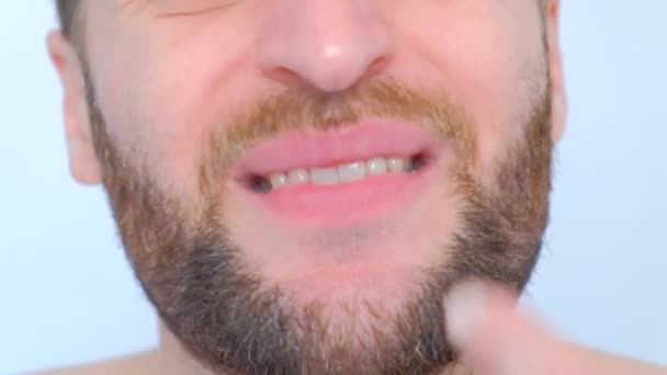 Close Male Mouth Big Lips White Teeth Picking Finger His — Stock Video
