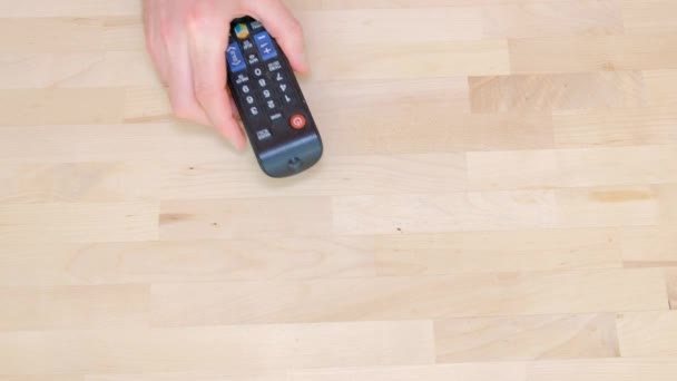 Male Hand Remote Control Switches Channels — Stock Video