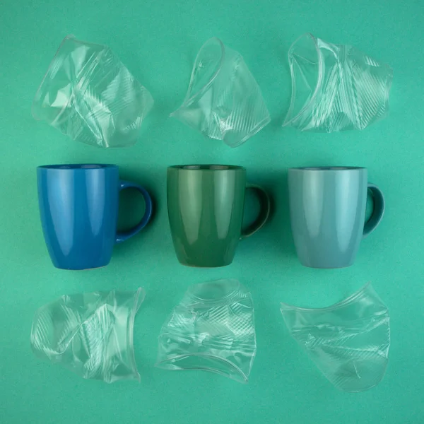 Ecology concept stop plastic pollution. Plastic waste. Pattern from ceramic mugs and plastic cups.