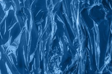 Plastik ambalajdan yapılmış soyut klasik mavi arkaplan. Tasarımınız için ideal arkaplan.