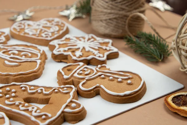 Christmas Ginger and Honey cookies on white surface. Star, fir tree, snowflake shape.