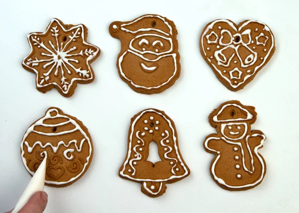 Christmas Ginger and Honey cookies on white surface. Star, fir tree, snowflake shape.