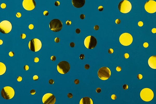Yellow gold metallic confetti dots on classic blue background.
