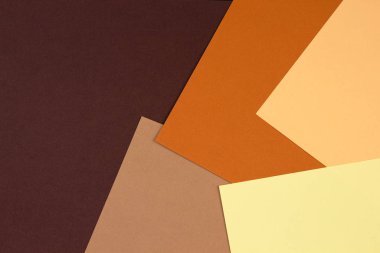 Toprak tonunda soyut geometrik kağıt arka plan. Toprak tonlarının çoğu kil toprak pigmentlerinden gelmektedir. Kum, toprak ve sienna gibi..