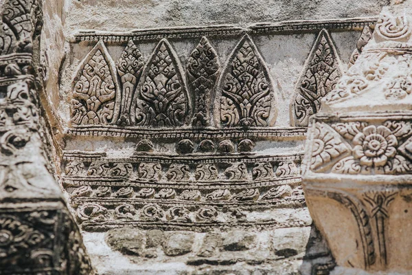Amazing details of the Wat Maha That temple with the ruins