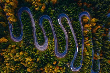 Scenic curvy road seen from a drone in autumn. Cheia, Romania. 