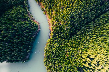 Lake with small boats seen from a drone 