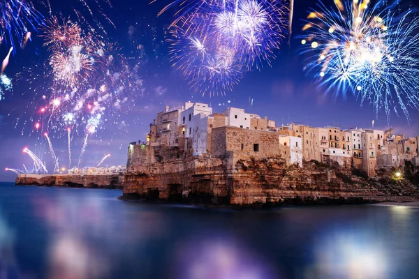 Fireworks celebrations in Polignano a Mare, Italy. New years eve and festival concept.