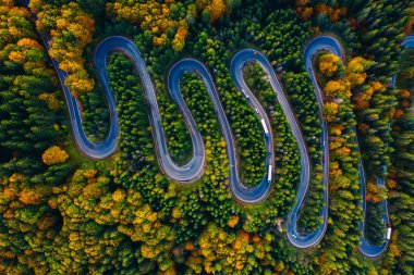 Scenic curvy road seen from a drone in autumn. Cheia, Romania. 