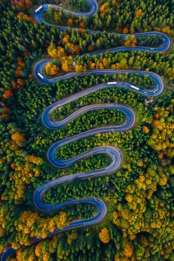 Scenic curvy road seen from a drone in autumn. Cheia, Romania. 