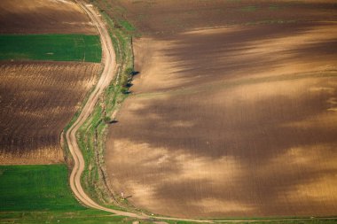 Rolling hills in spring. Agricultural farmland.